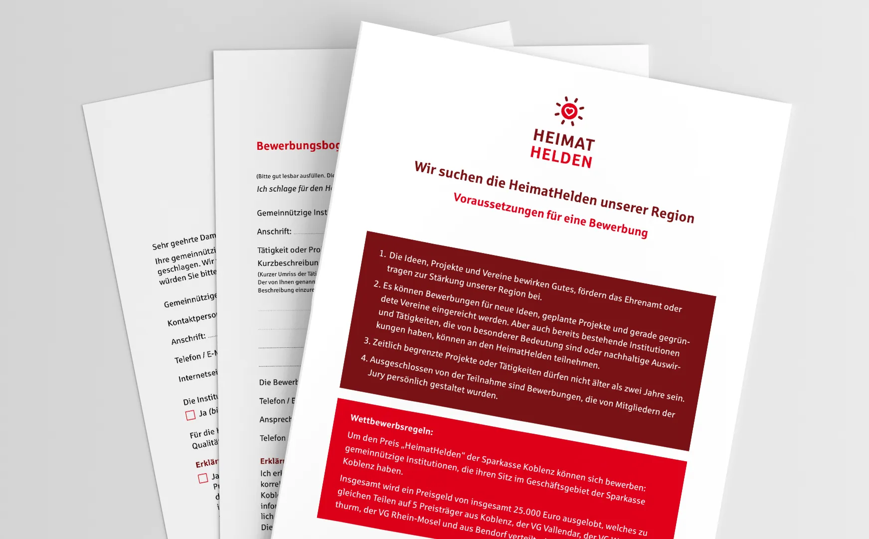 Bewerbungsunterlagen für den HeimatHelden-Preis mit rotem Titelblatt